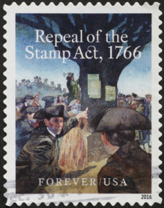 Gedenkbriefmarke aus Mailand zur Rücknahme des Stempelgesetz Stamp Act, Bildnachweis: Spatuletail / Shutterstock.com